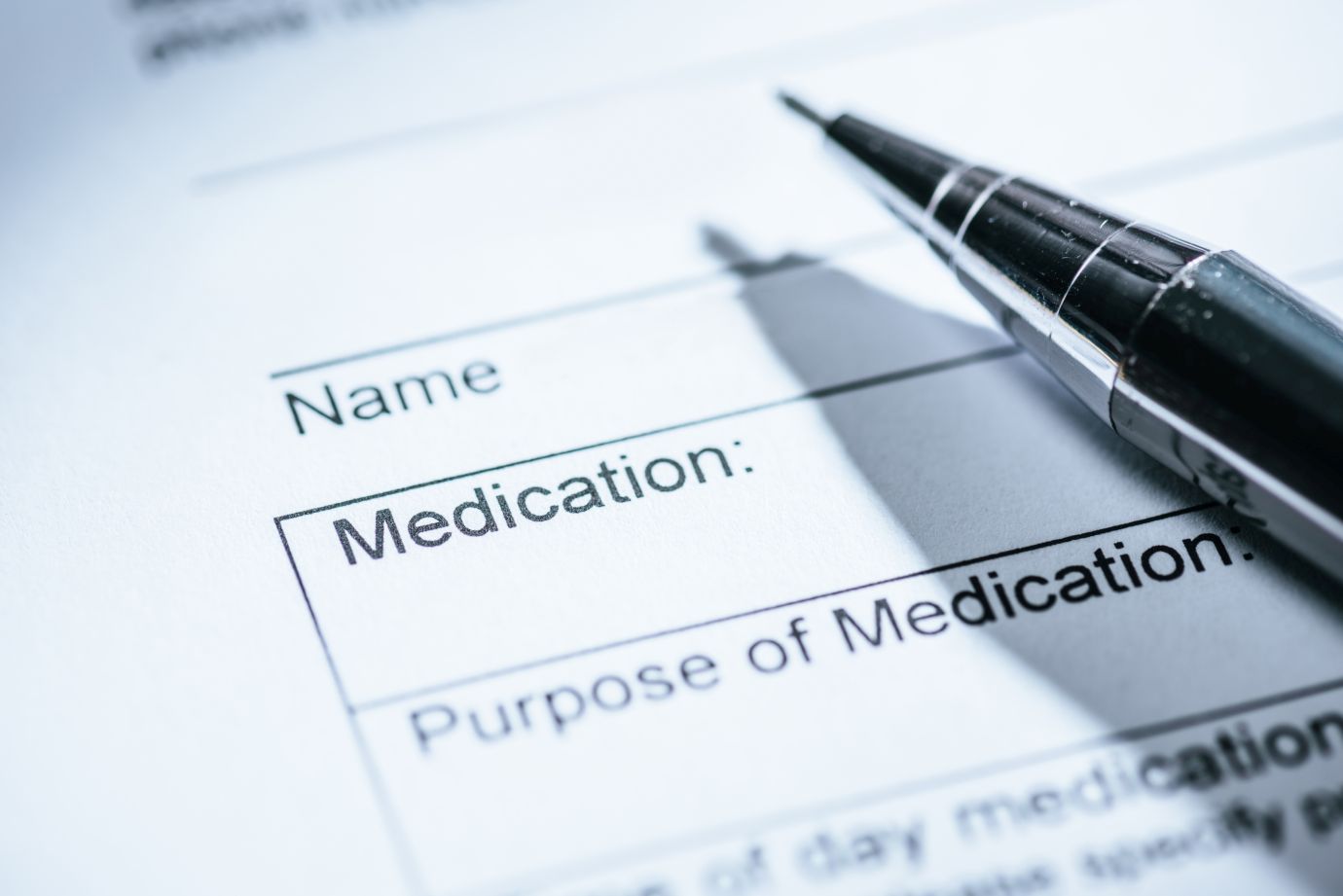 selective focus of medical questionnaire with pen